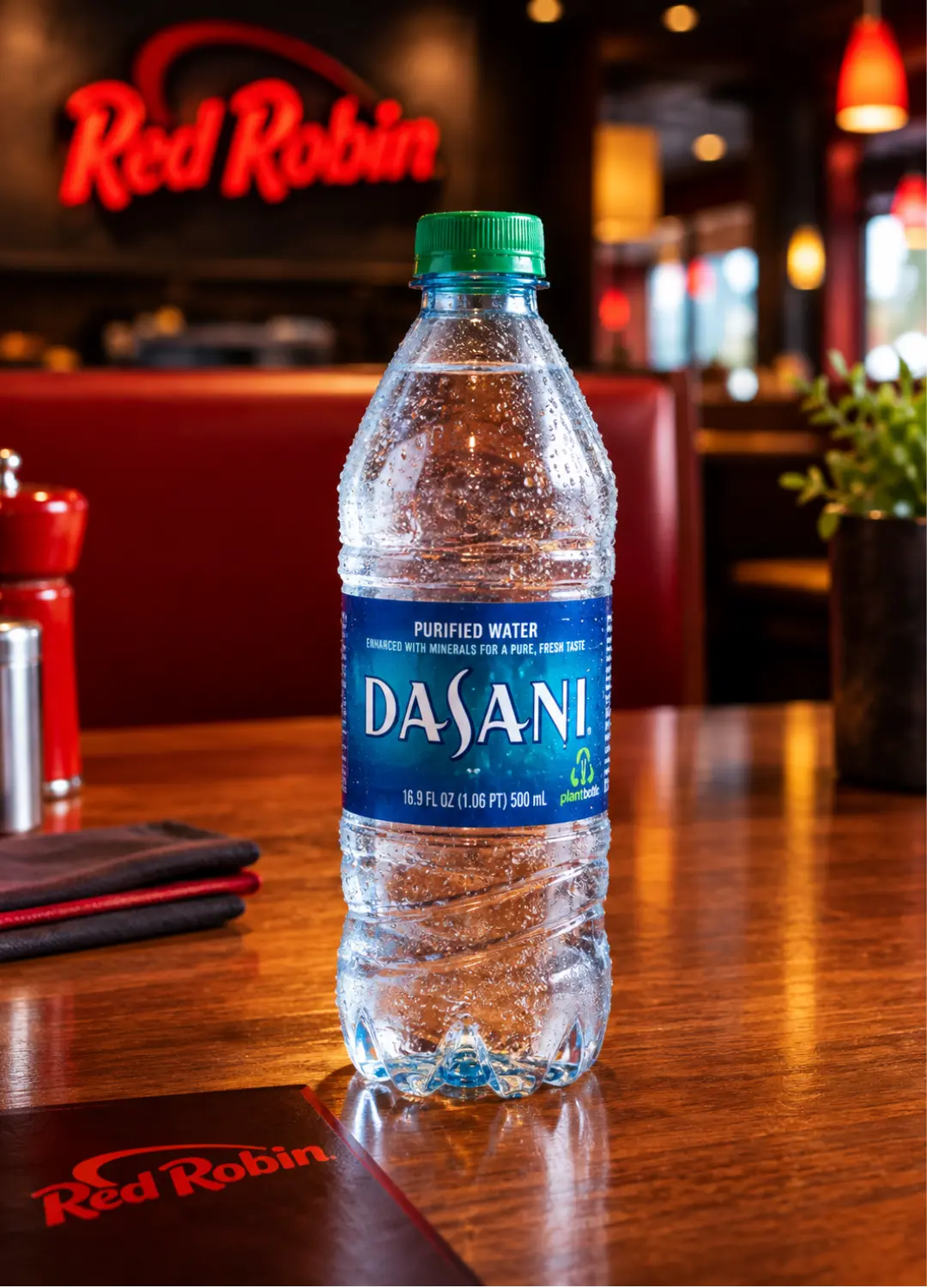 Red Robin bottled water on a restaurant table