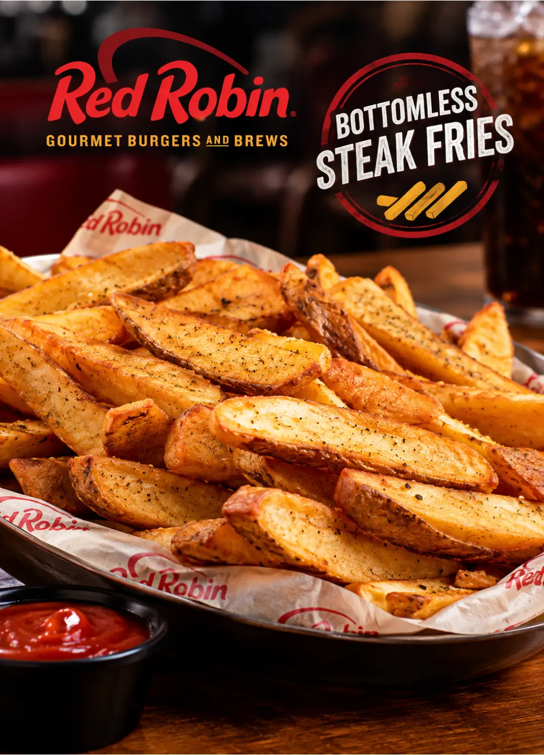 Basket of Red Robin Bottomless Steak Fries with seasoning salt