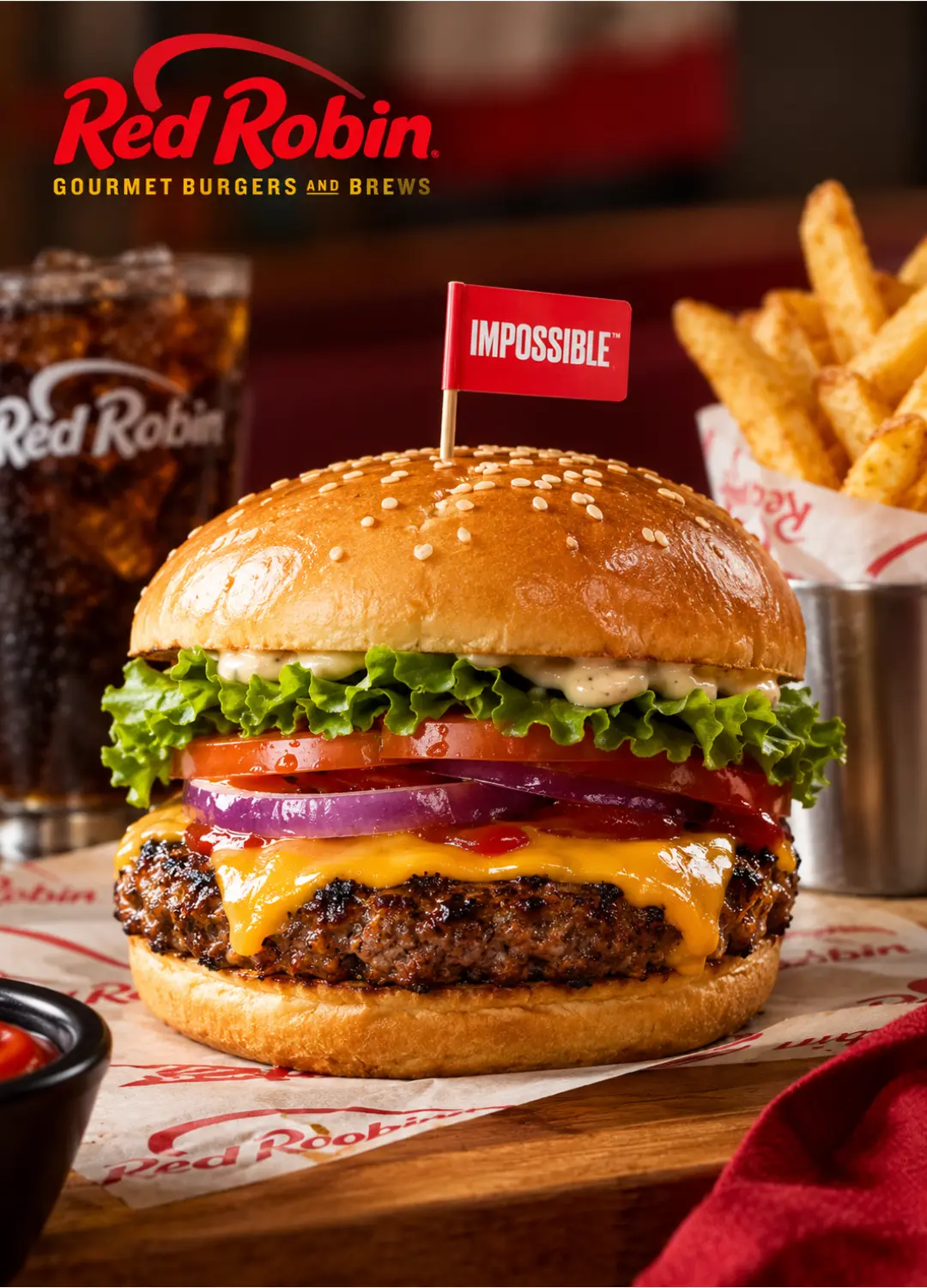 Red Robin Impossible Cheeseburger with lettuce, tomato, and melted cheese on a toasted bun